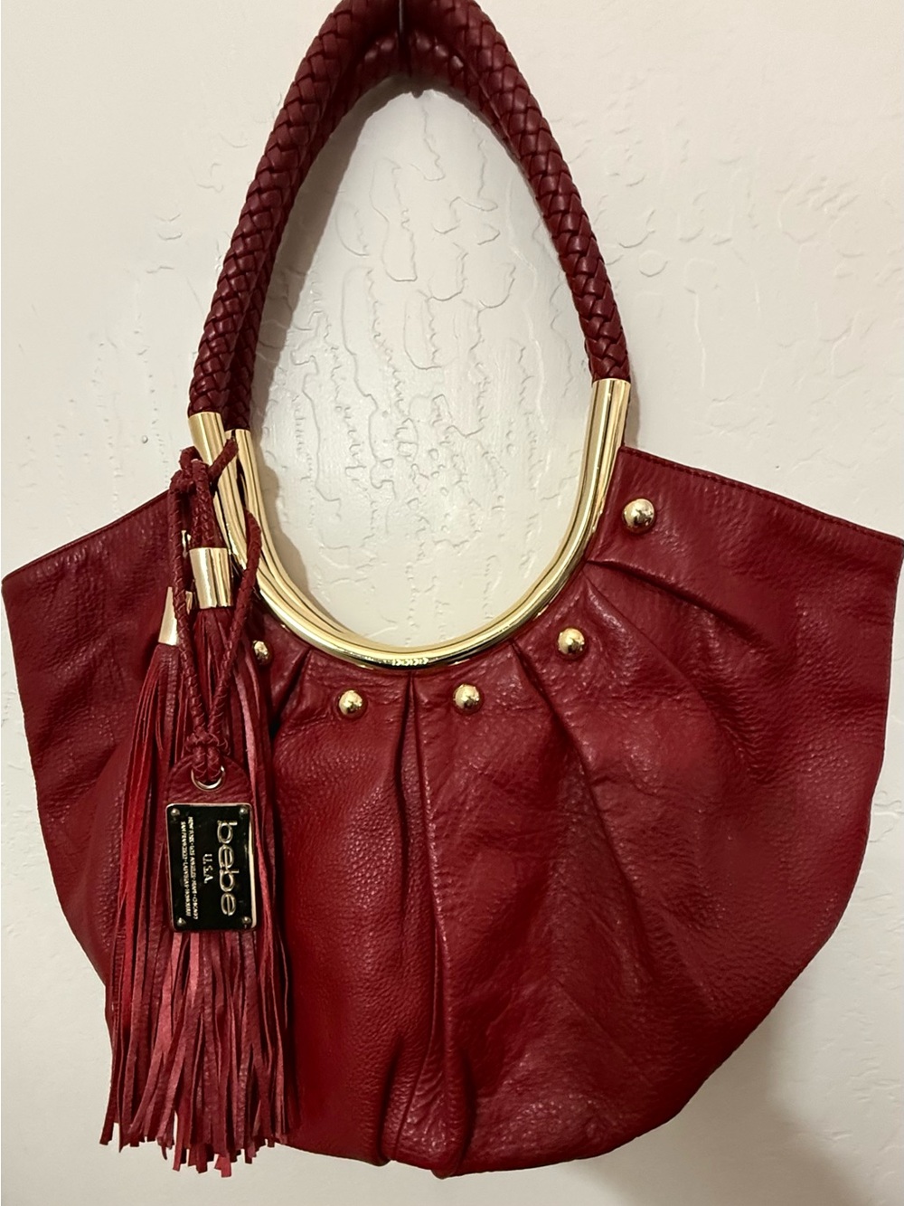 bebe Burgundy Shoulder Tote with Braided Handle and Gold Hardware